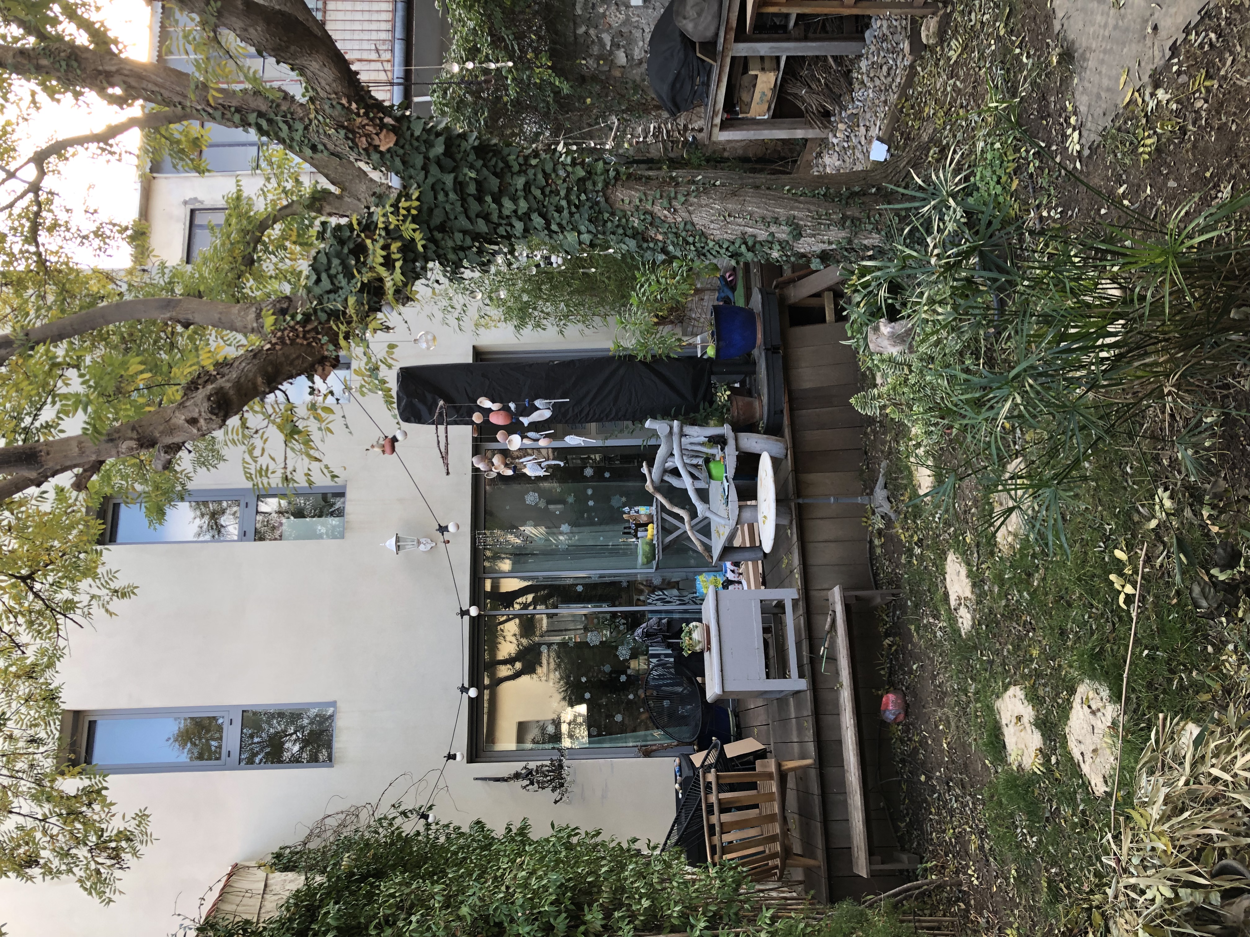 north-facing bay window overlooking a city garden