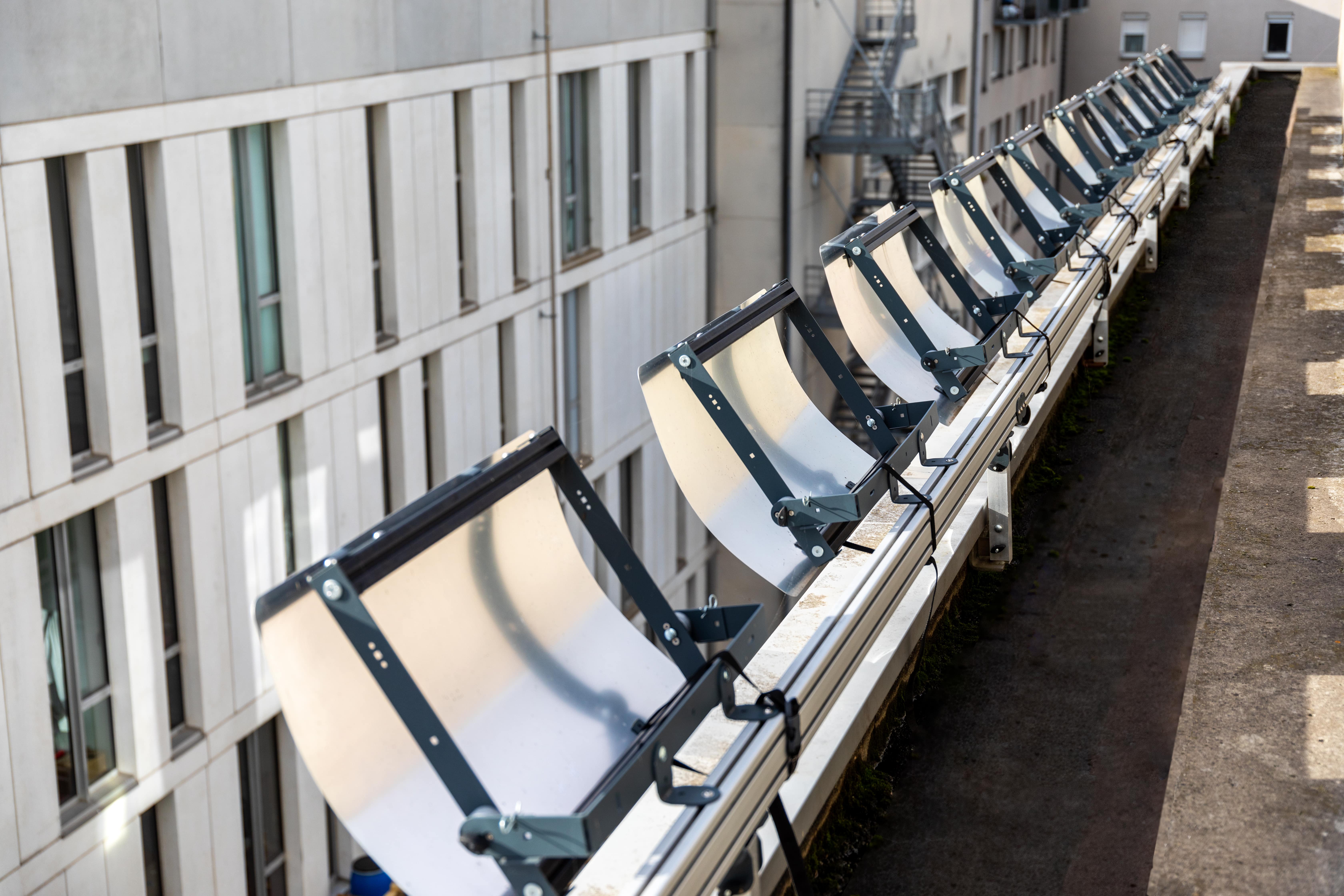 Espaciel solar reflectors installed on top of a building